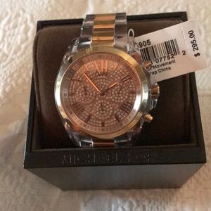 Michael Kors Clear and rose gold watch.